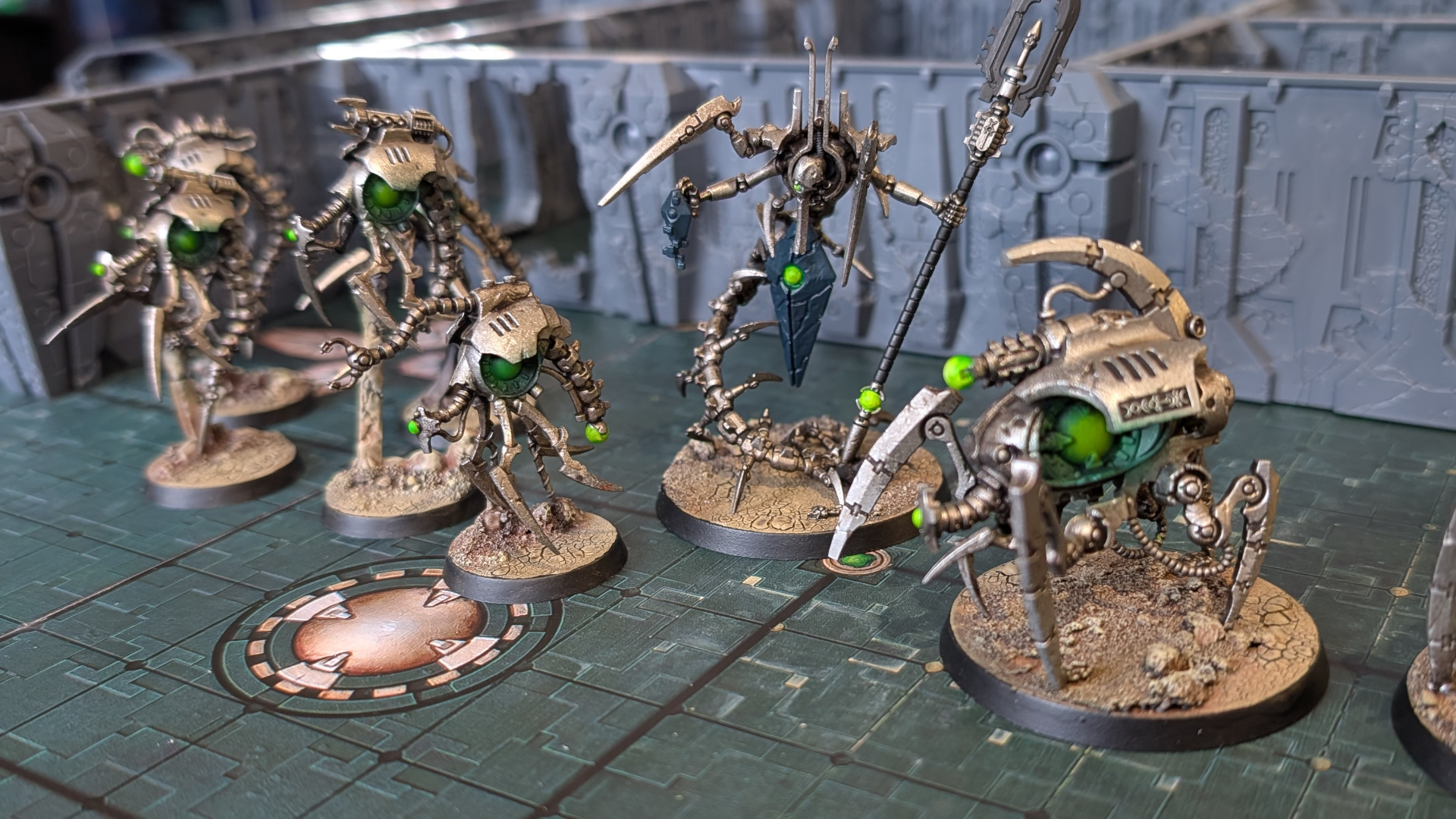 Kill Team: Tomb World Necron miniatures laid out across the board, in front of terrain