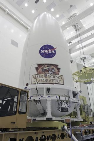 In the Payload Hazardous Servicing Facility at NASA's Kennedy Space Center in Florida, the Atlas 5 rocket's payload fairing containing NASA's Mars rover Curiosity stands securely atop the transporter that will carry it to Space Launch Complex 41 on Nov. 3, 2011.