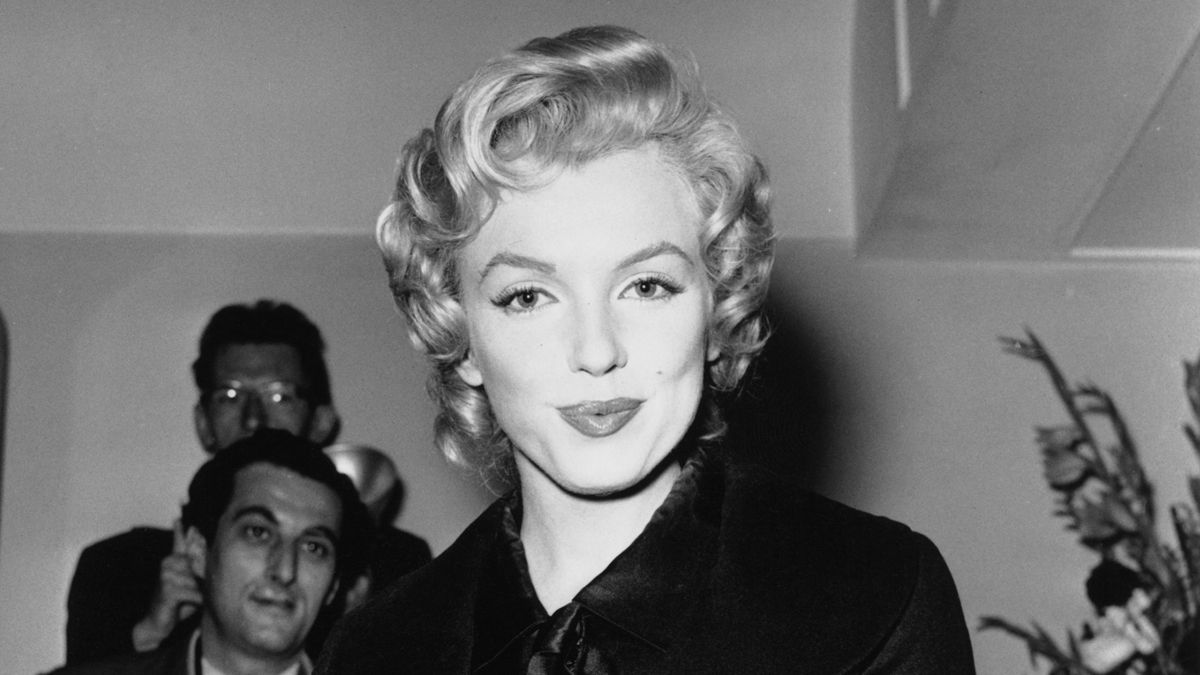 American actress Marilyn Monroe (1926 - 1962) at a press conference at the Savoy Hotel, London, July 1956. Monroe is in England to film 'The Prince and the Showgirl' with English actor and di