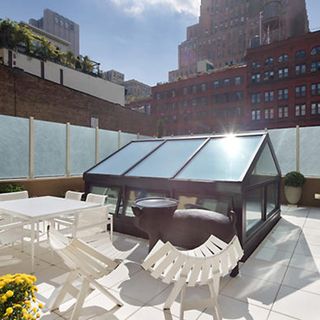 spacious roof terrace surrounded by paper glass walls