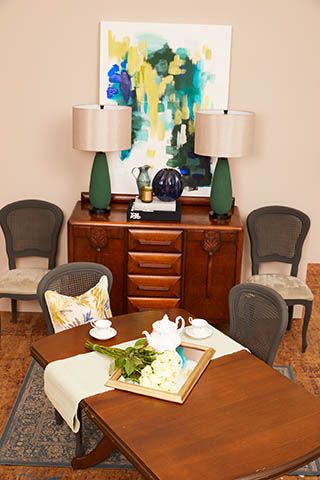 dining room with wooden furniture and statement artwork