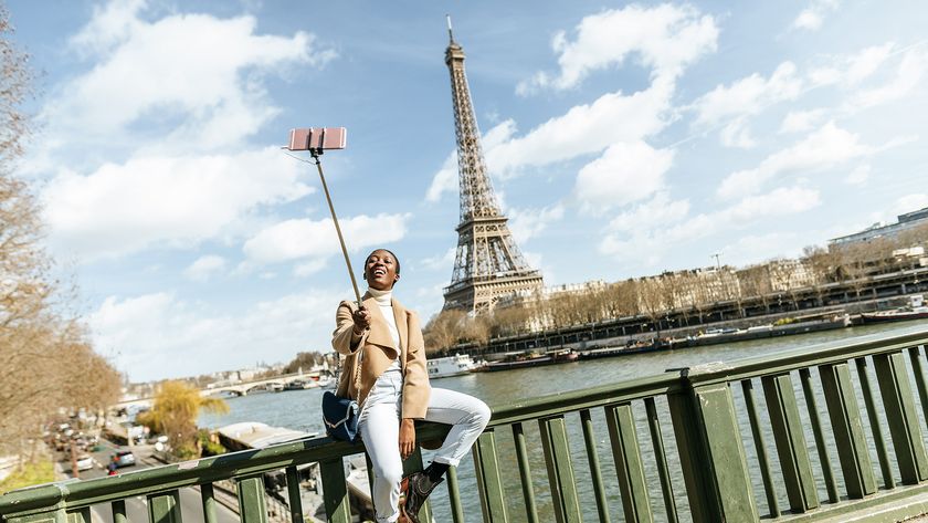 Woman using selfie stick in paris