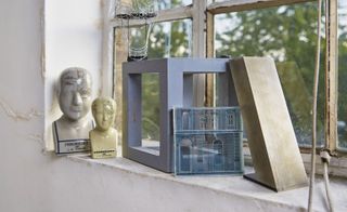 On the window sill, two phrenology heads, used for Elegy for Young Lovers, sit next to a façade for Otello, 2015, at the Met Opera, New York, and a geometric sculpture for Kanye West’s tour