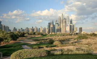 Emirates Golf Club pictured with the Dubai skyline