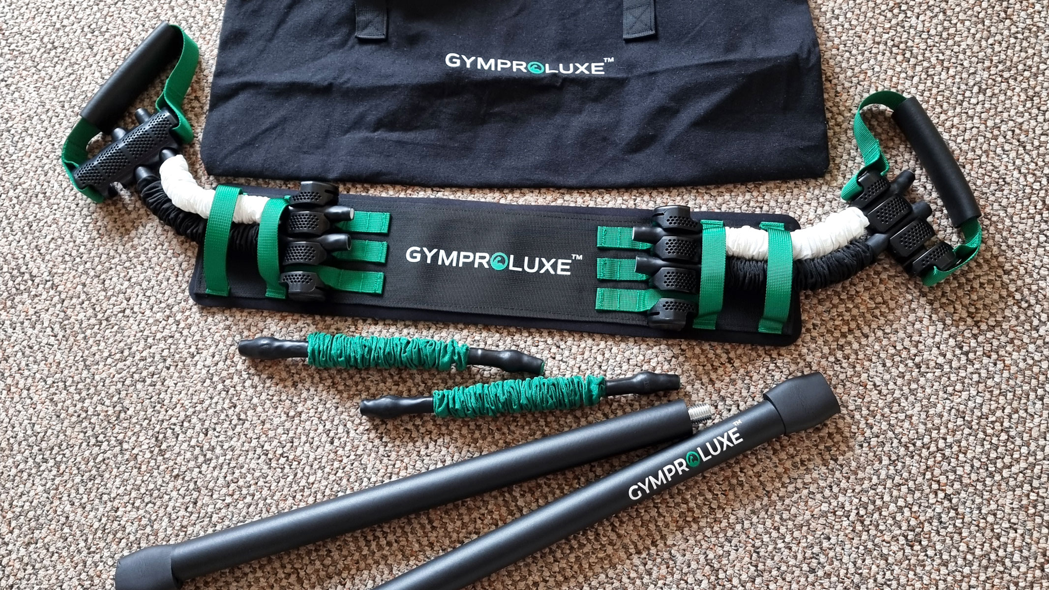 Gymproluxe all-in-one portable gym set laid out on the floor