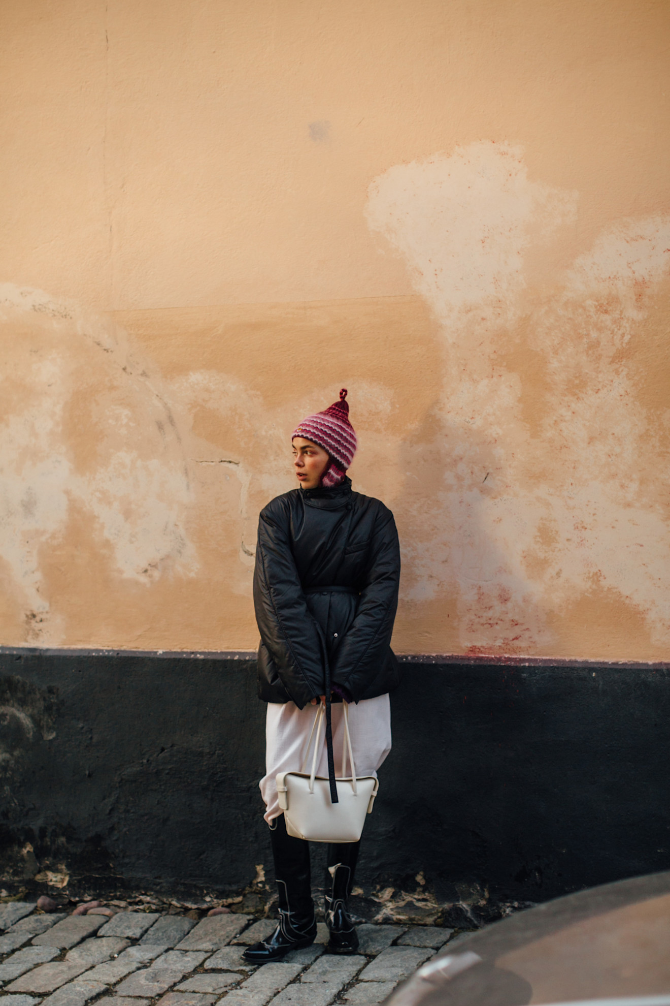 A woman at fashion wearing a puffer jacket outfit
