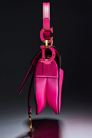 An image of the hot pink fuschia Dior Saddle bag, part of marie claires The One franchise