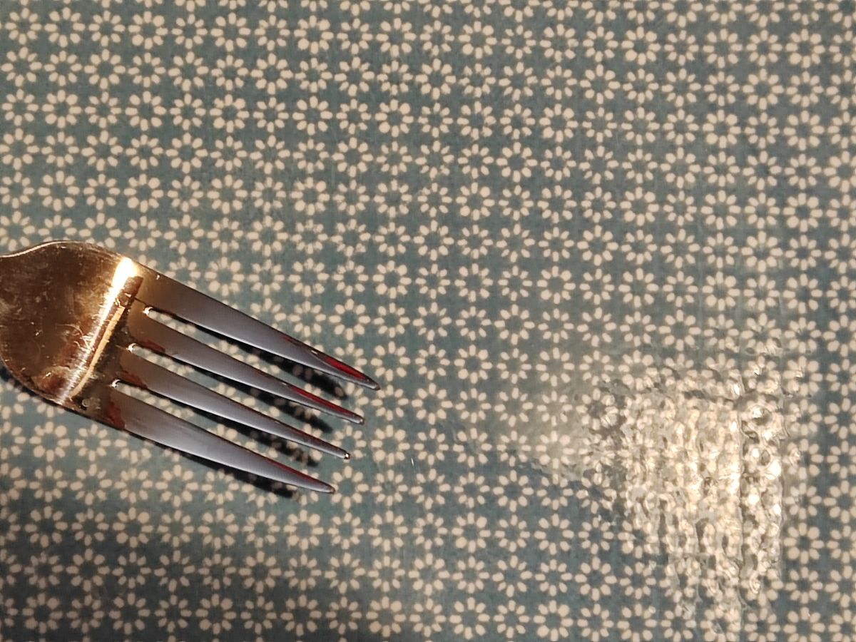 A picture of a silver fork on a table taken with an Honor 70 camera