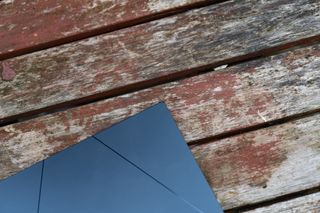 A black ASUS Zenbook 15 OLED laptop sitting on a table