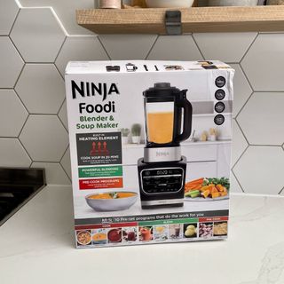 Ninja Foodi HB150UK Blender and Soup Maker in box on white marble kitchen counter