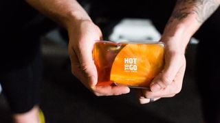 Best handwarmers: two hands holding a pack of Hot to Go hand warmers