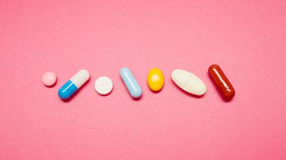 Pills on colored background