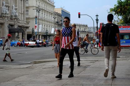 A Cuban wears an American flag shirt in Havana