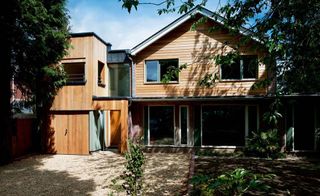 A 1970s home on a Hampshire cul-de-sac has been transformed into a modern, eco-friendly timber clad home.