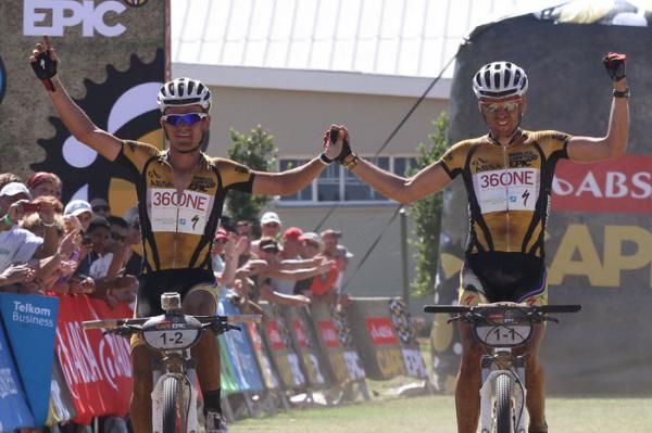 Burry Stander &amp; Christoph Sauser (36One-Songo-Specialized team) celebrate after winning stage 1