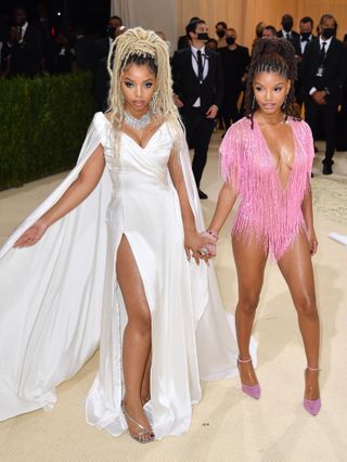 Chloe Bailey and Halle Bailey arrive for the 2021 Met Gala wearing looks by fellow sisters Kate and Laura Mulleavy of Rodarte.
