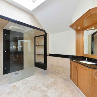 modern bathroom with wooden drawers