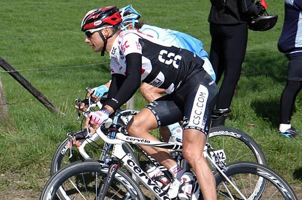 Dutch rider Karsten Kroon (Team CSC) rides around the outside of another rider.