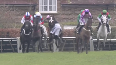 Joe Anderson makes a miracle recovery after he was left hanging round the neck of Transmission in the stayers' hurdle at Plumpton Racecourse.