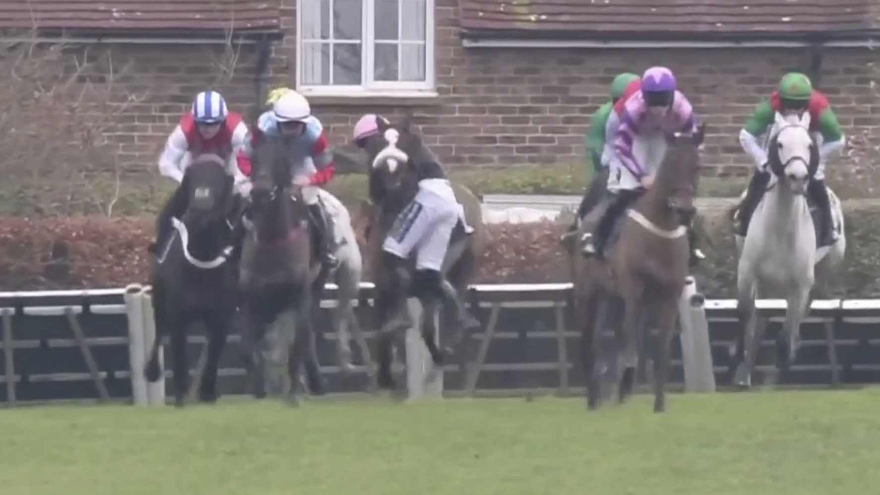 Joe Anderson makes a miracle recovery after he was left hanging round the neck of Transmission in the stayers' hurdle at Plumpton Racecourse.