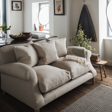 Cream sofa in neutral, rustic living room