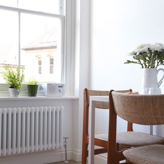 room with white wall and coffee table and chairs