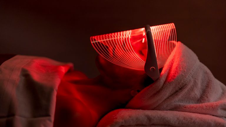 woman in an infrared sauna blanket