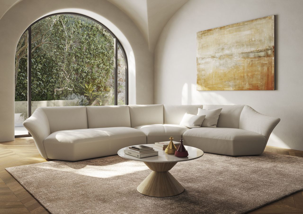 &#039;Timeless&#039; sofa by Natuzzi Italia in neutral-toned living room