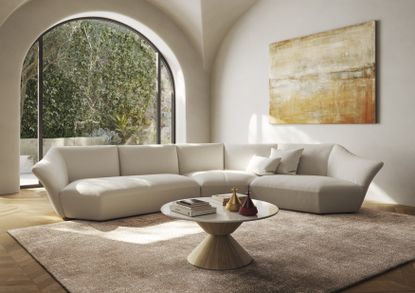'Timeless' sofa by Natuzzi Italia in neutral-toned living room