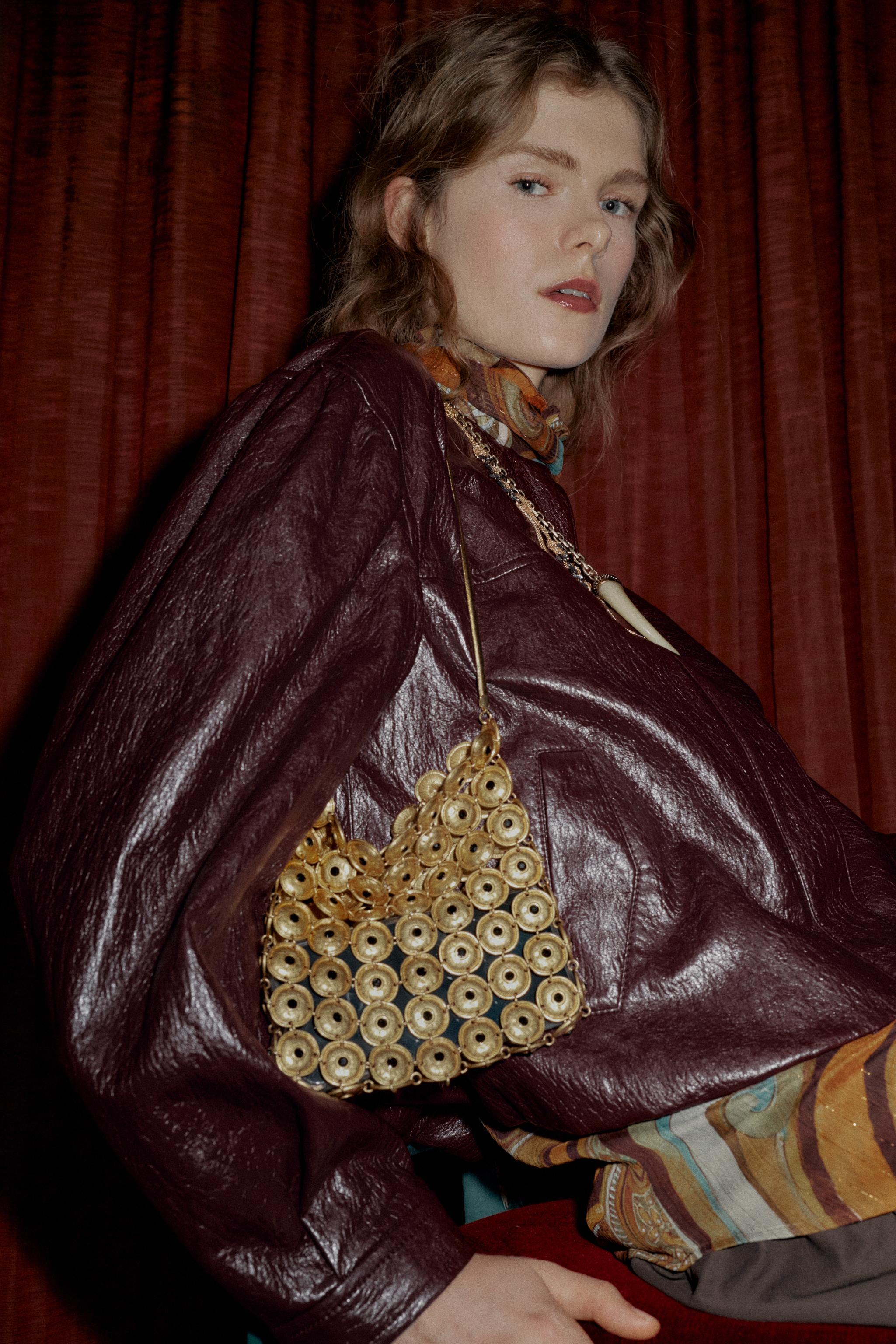 metal applique and acute; bucket bag