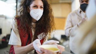 woman volunteering at a soup kitchen