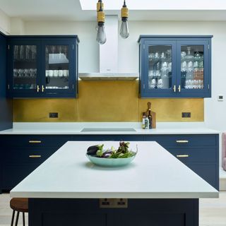 kitchen with blue cabinet and white counter top