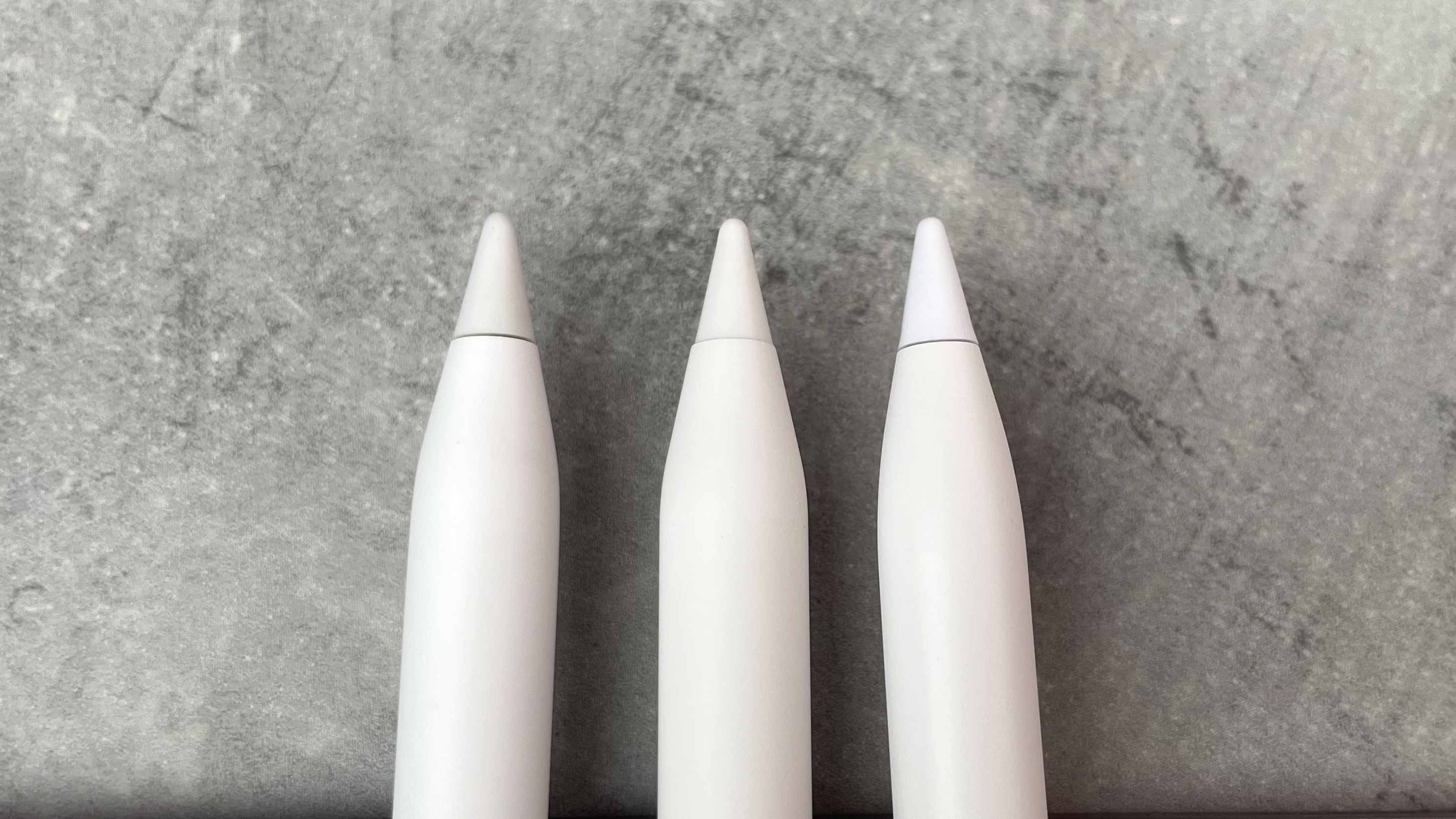 From left to right, the tips of the Apple Pencil USB-C, the Metapen Pencil Air8, and the ESR Geo Digital Pencil are pictured in a row.