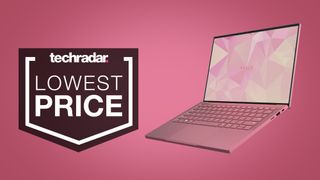 Razer Book 13 in Quartz pink on a pink background with a 'LOWEST PRICE' TechRadar deals badge.