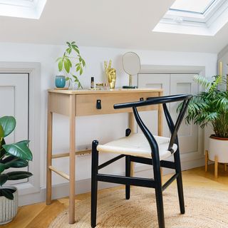 bedroom with dressing table and chair