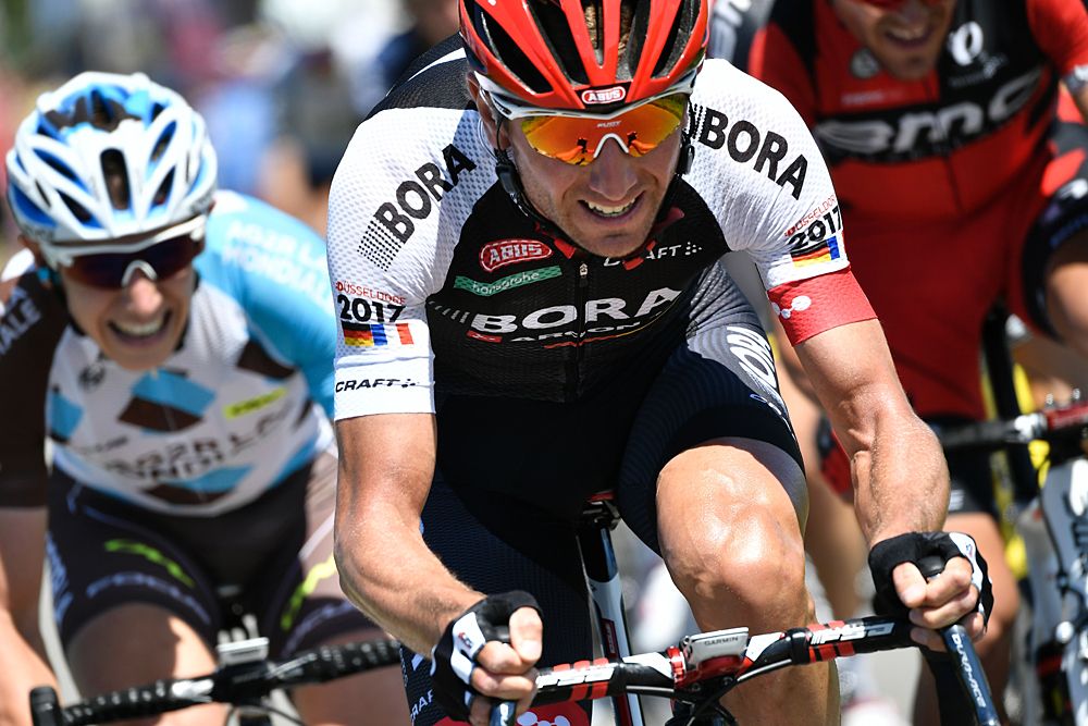 France's Cyril Gautier (L) and Poland's Bartosz Huzarski ride in a breakaway