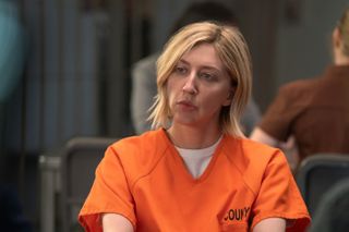 Heidi Gardner, sitting in a county jail wearing a yellow prison uniform, in 'Shrinking'