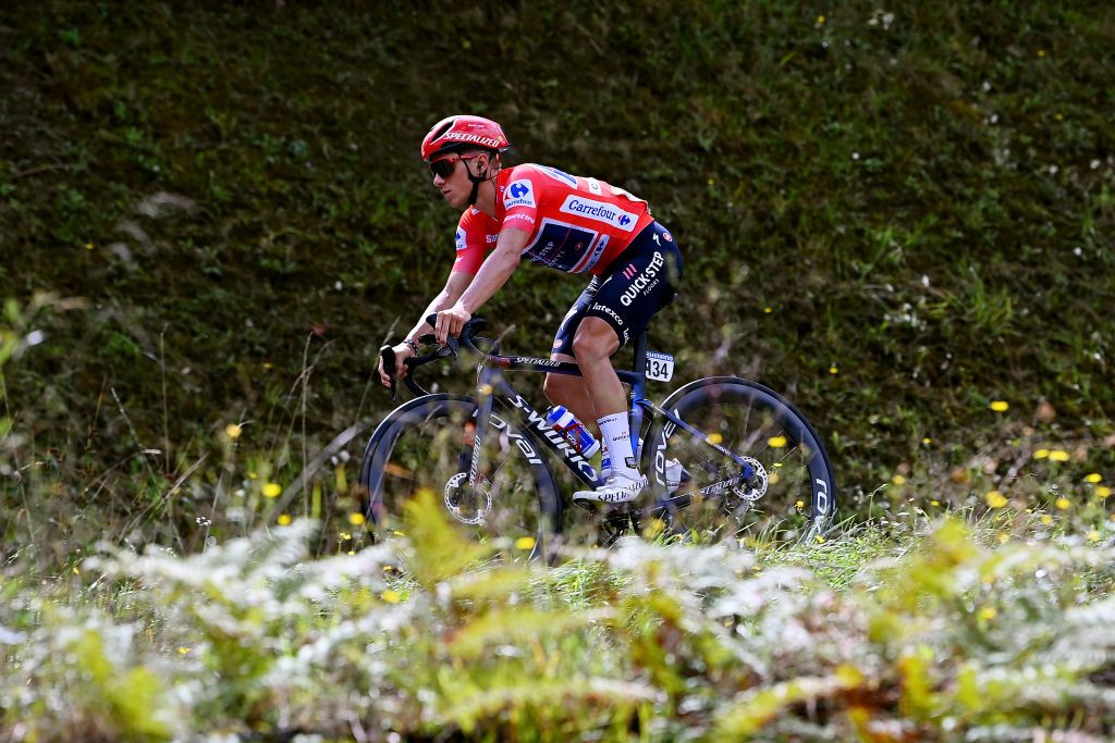 CISTIERNA SPAIN AUGUST 26 Remco Evenepoel of Belgium and Team QuickStep Alpha Vinyl Red Leader Jersey competes during the 77th Tour of Spain 2022 Stage 7 a 190km stage from Camargo to Cistierna LaVuelta22 WorldTour on August 26 2022 in Cistierna Spain Photo by Tim de WaeleGetty Images