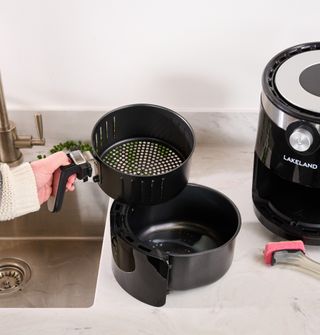 removable inserts of air fryer on countertop