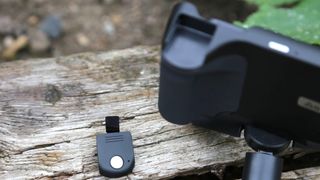 Adonit PhotoGrip Qi's pop-out shutter release