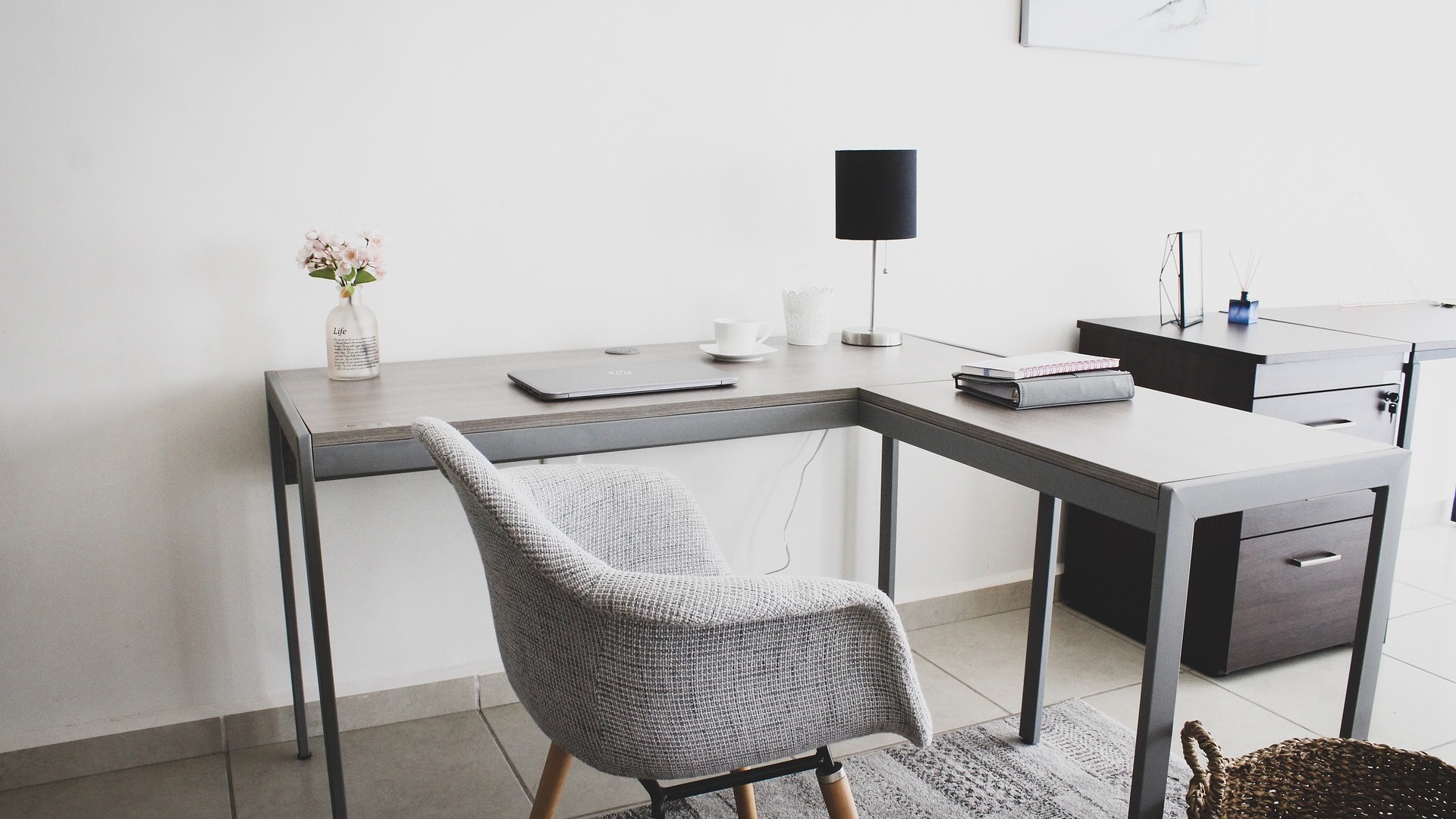 A chair next to a work desk.