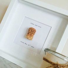 frame with gift and champagne pop