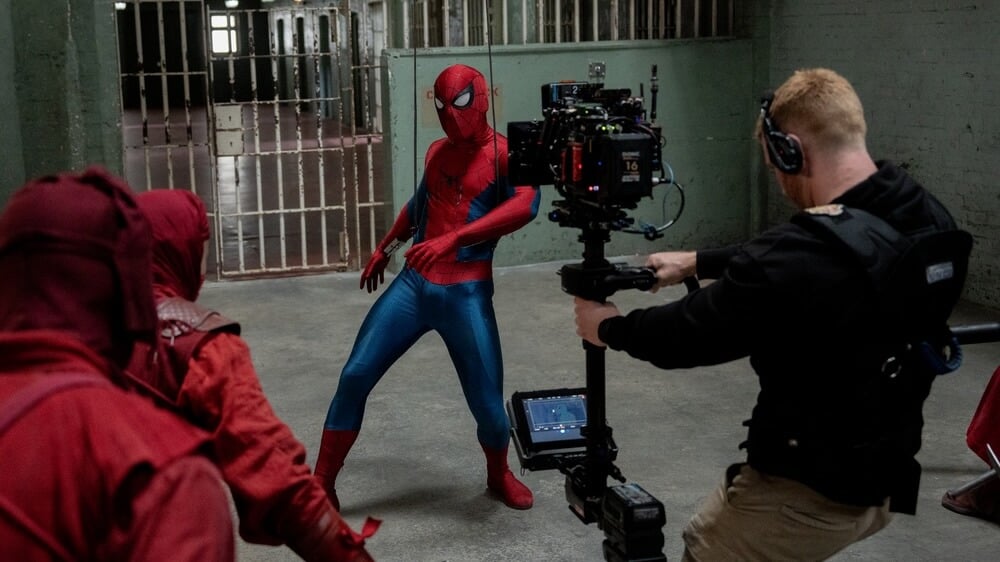 Set photos from Spider-Man: Brand New Day showing crew filming with an Alexa 265 and a custom Panavision lens