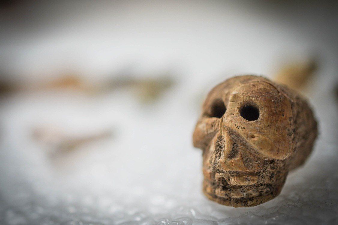 An amulet depicting a human skull.