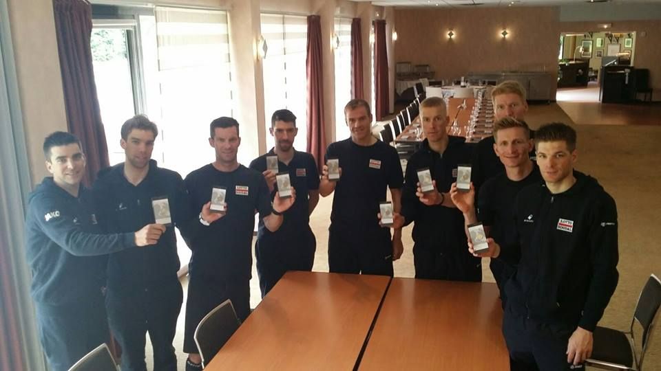 Lotto Soudal hold up their coins of hope
