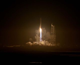 An upgraded Orbital ATK Antares rocket soars into the night sky over NASA's Wallops Flight Facility on Wallops Island, Virginia on Oct. 17, 2016, beginning a Cygnus cargo delivery mission to the International Space Station for NASA. It was Orbital ATK's f