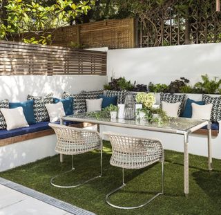 garden area with patio table and couch