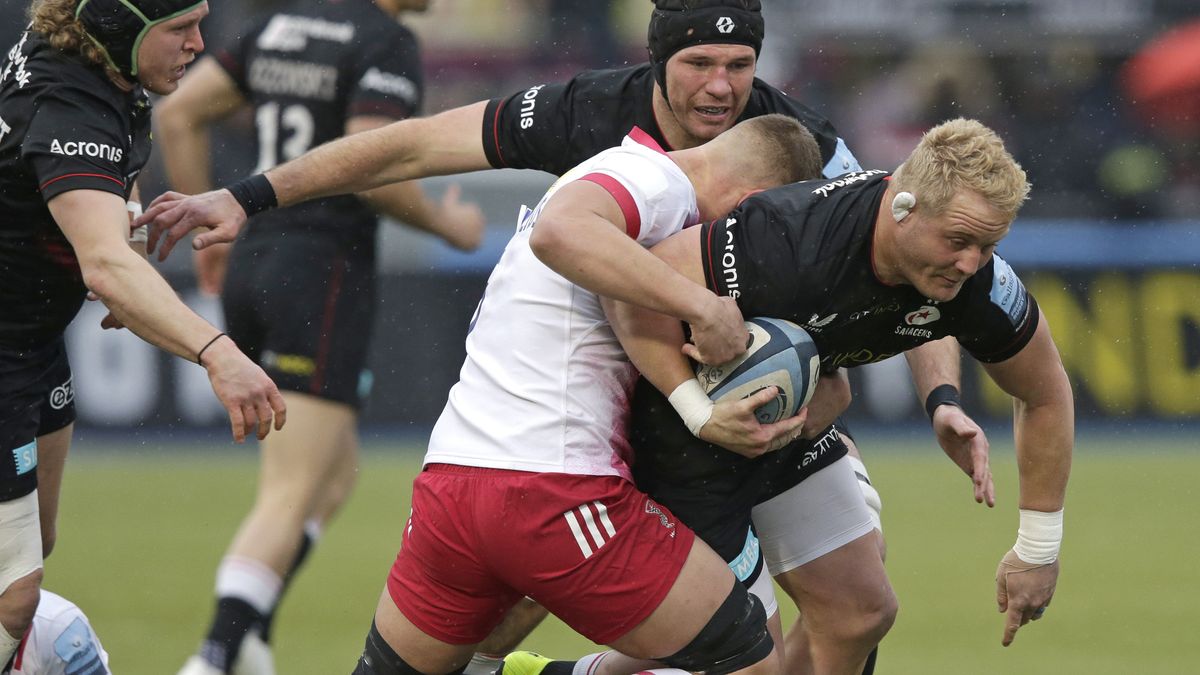 Vincent Koch of Saracens is tackled by Matas Jurevicius of Harlequins during the Gallagher Premiership Rugby match