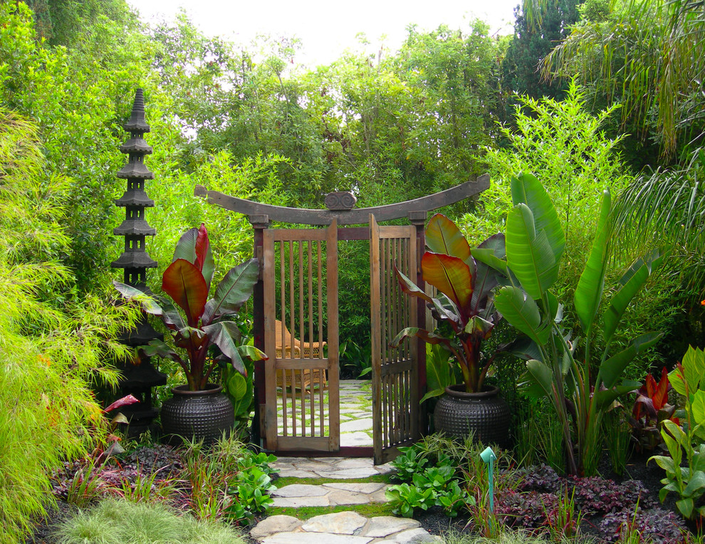 world-inspired garden with a japanese-style garden gate by Zeterre Landscape Architecture