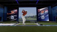 Tiger Woods hits a shot into TGL's giant screen at SoFi Center in Florida